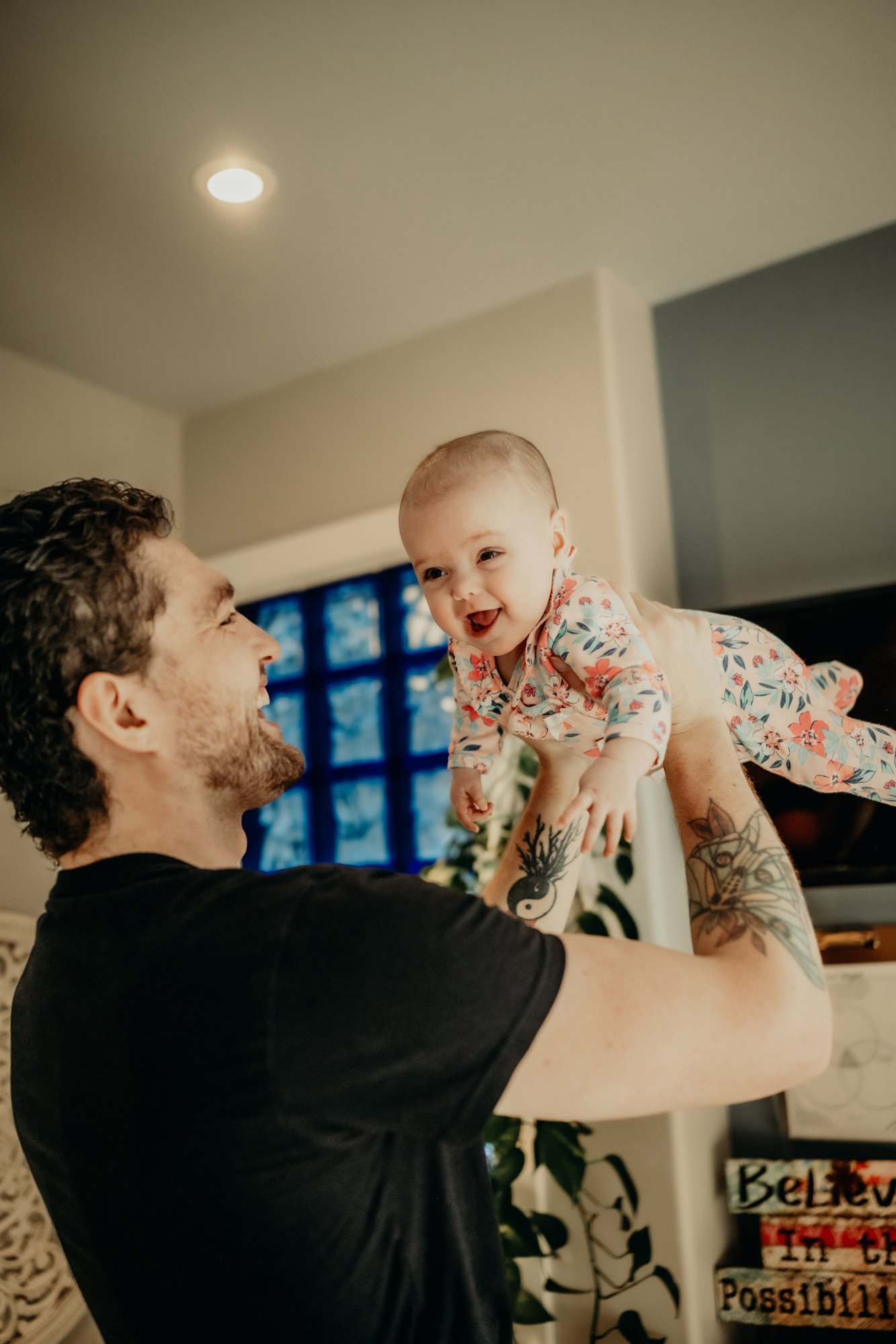 Father and baby laughing