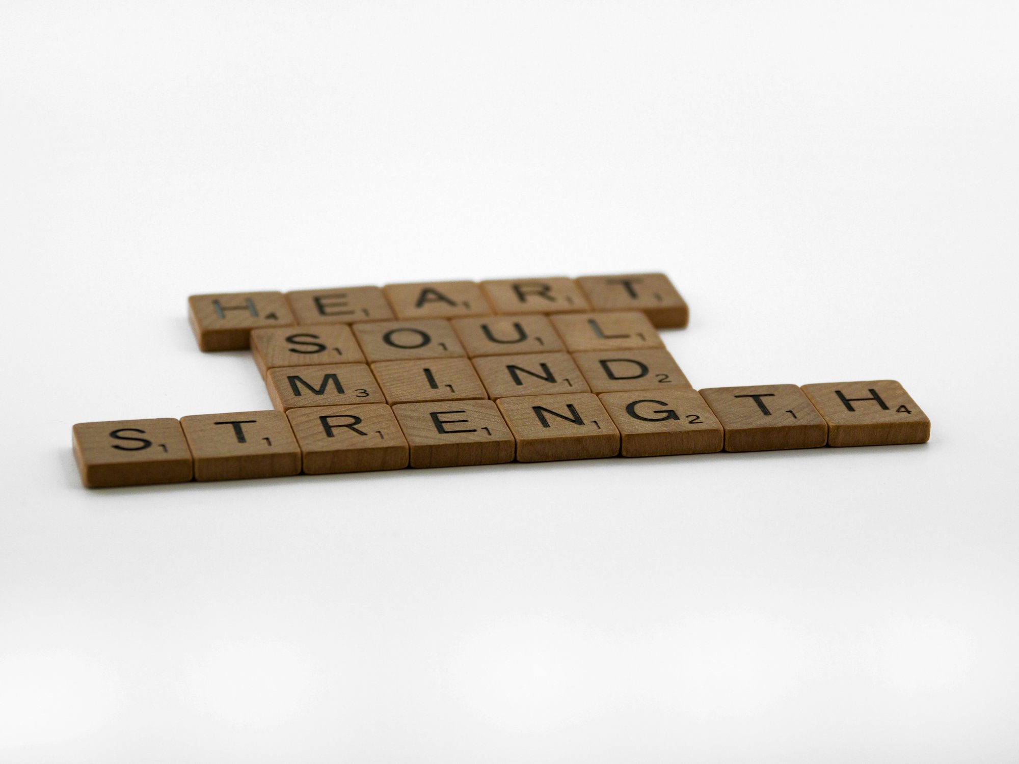 Scrabble tiles spelling Heart, Soul, Mind, Strength